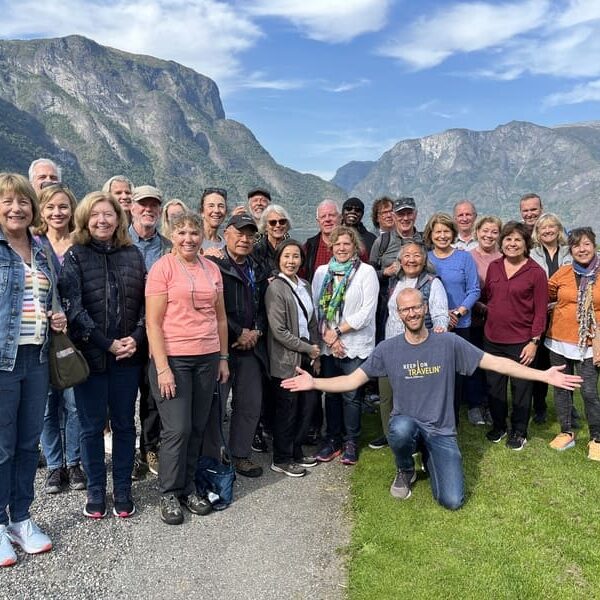 A happy Rich Steves Tour Group on a sunny day with Pål in Norway