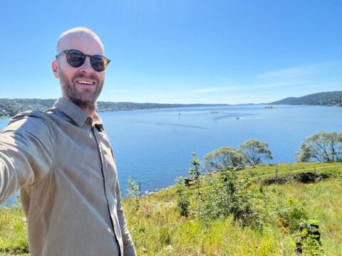 On an island in Oslo on a sunny day man with sunglasses